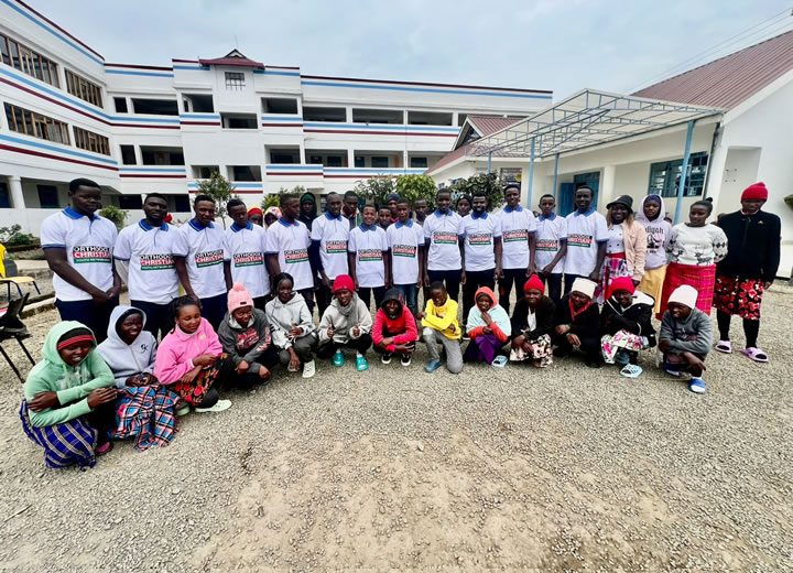 Youth mission team outside the school